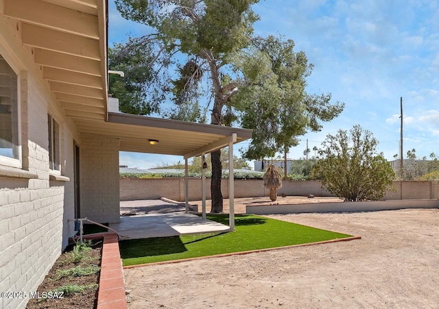 view of yard with a patio and a fenced backyard