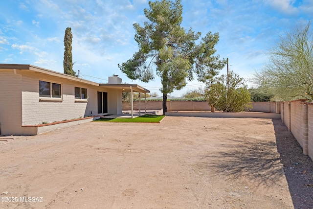 view of yard with a patio area and a fenced backyard