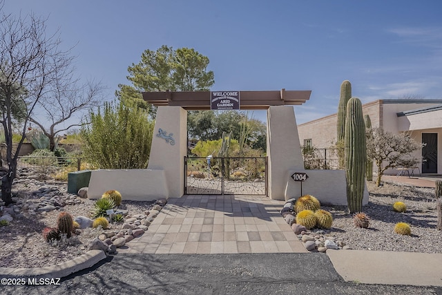 view of gate featuring a fenced front yard