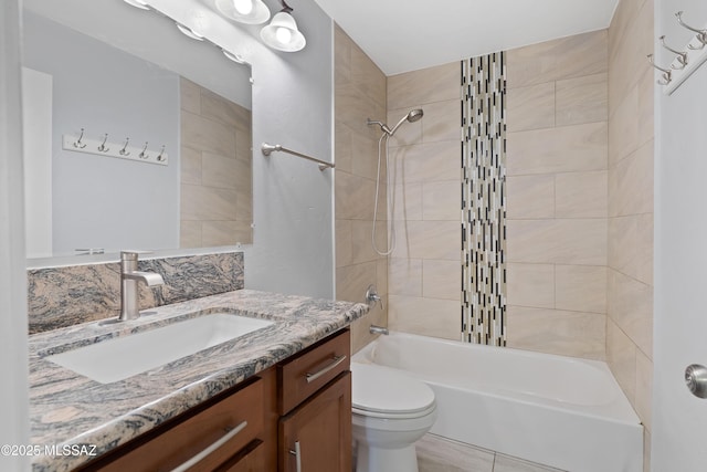 bathroom with toilet, shower / washtub combination, and vanity