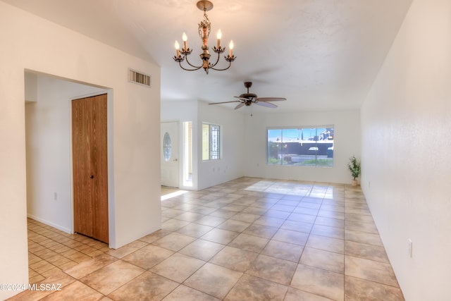 spare room featuring ceiling fan with notable chandelier, visible vents, and light tile patterned flooring