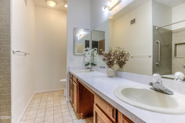 full bathroom with toilet, tile patterned flooring, a sink, and visible vents