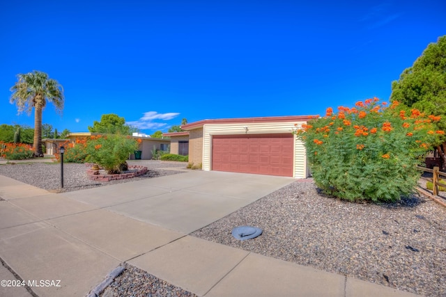 view of front of property with brick siding, driveway, and an attached garage