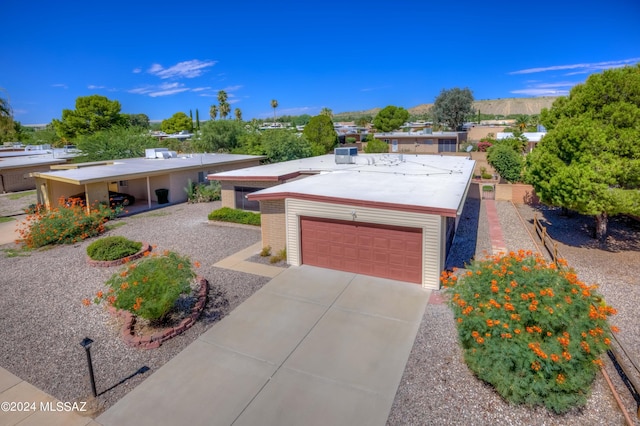 view of front of property with a garage and driveway