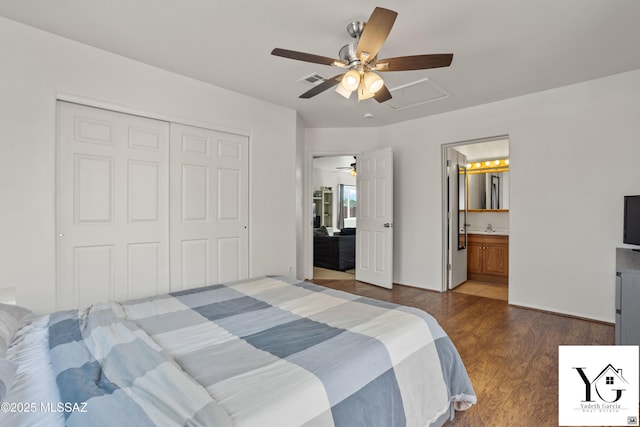 bedroom featuring ceiling fan, dark wood-style flooring, visible vents, a closet, and ensuite bath