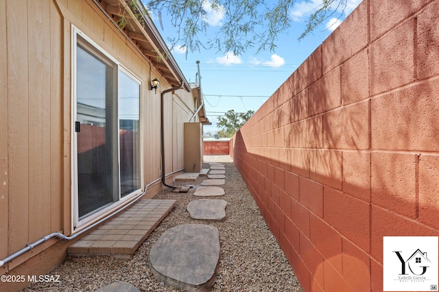 view of property exterior with fence