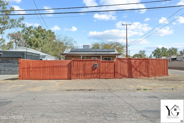 view of yard featuring a fenced front yard and a gate