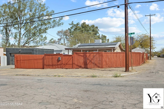 view of yard featuring a fenced front yard and a gate