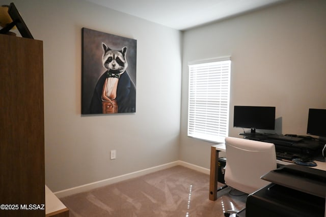 carpeted home office featuring baseboards