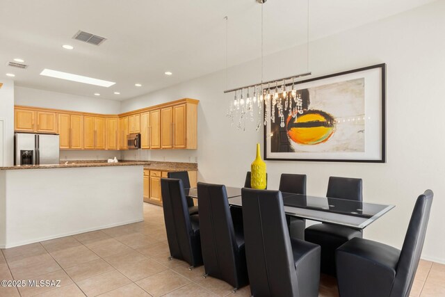 dining room with recessed lighting, visible vents, a notable chandelier, and light tile patterned floors