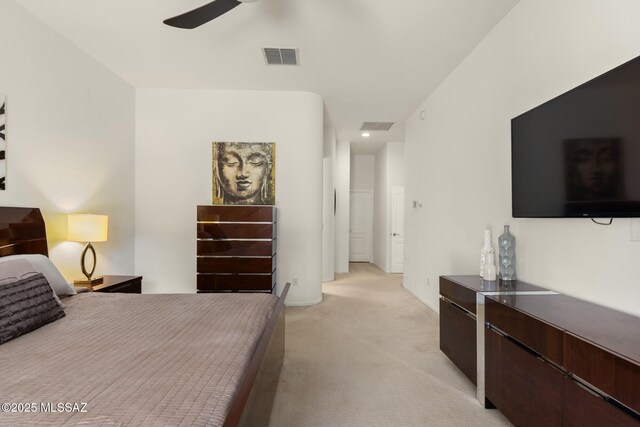 bedroom with light colored carpet and visible vents