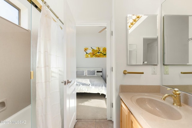 full bath featuring a shower with curtain, vanity, ensuite bathroom, and tile patterned floors