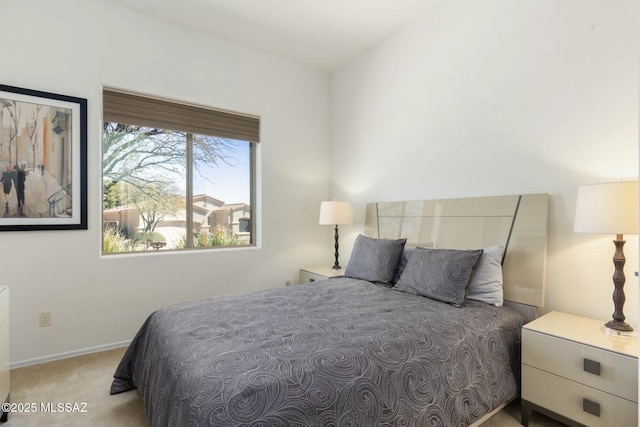 bedroom with carpet and baseboards