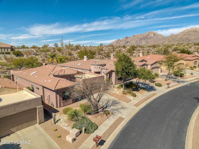 drone / aerial view featuring a mountain view and a residential view