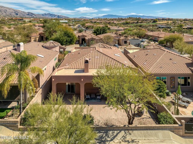 birds eye view of property featuring a residential view and a mountain view