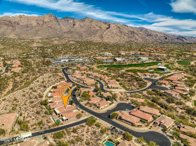 birds eye view of property with a mountain view