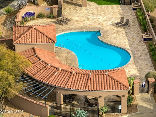 view of pool featuring a patio