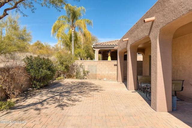 view of patio / terrace featuring fence