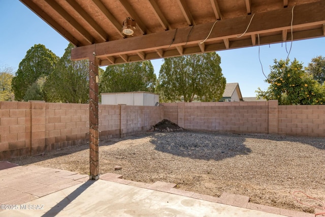 view of yard featuring a patio area and a fenced backyard