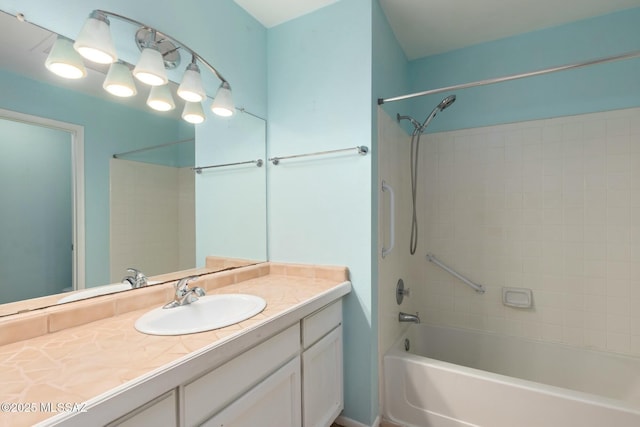 bathroom featuring shower / washtub combination and vanity