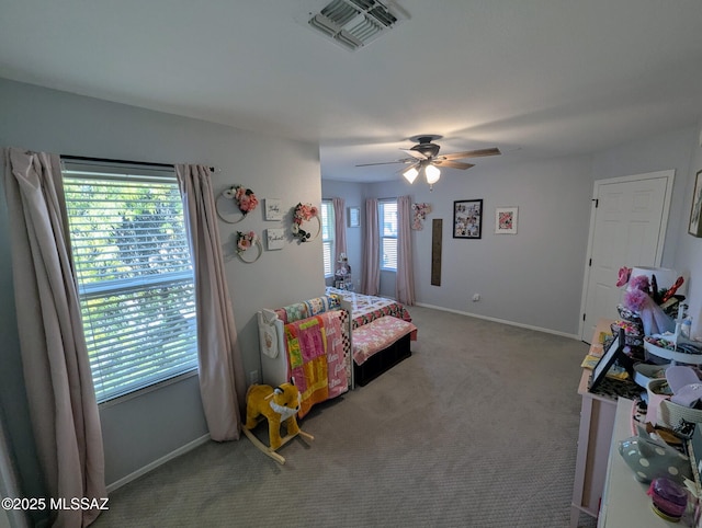 bedroom with carpet, visible vents, ceiling fan, and baseboards