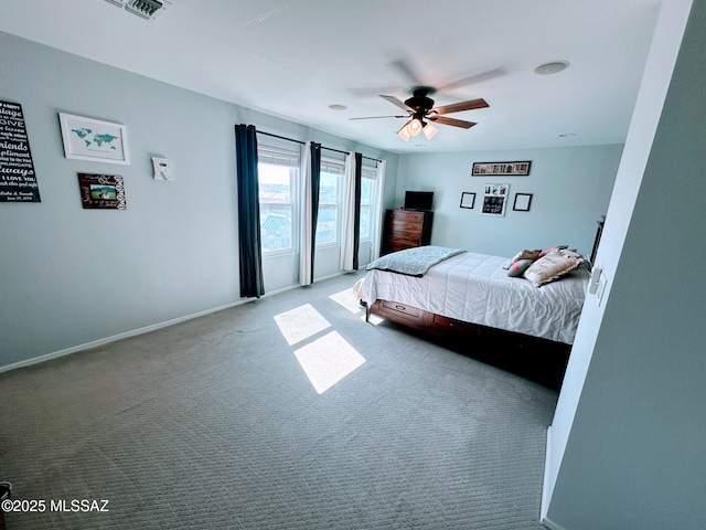 bedroom featuring a ceiling fan, carpet flooring, and baseboards