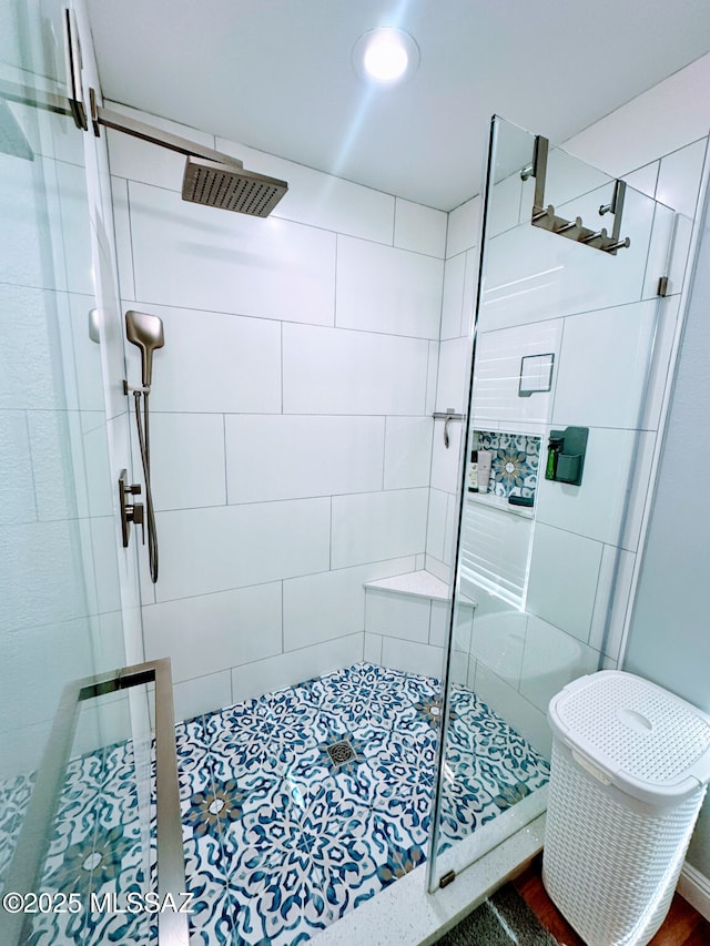 bathroom featuring a stall shower and visible vents