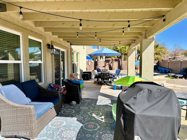 view of patio featuring outdoor dining area, a fenced backyard, an outdoor hangout area, and grilling area