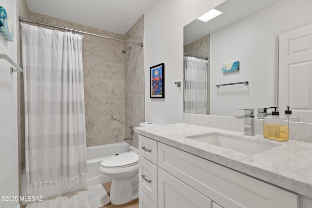 bathroom featuring wood finished floors, toilet, vanity, and shower / bathtub combination with curtain