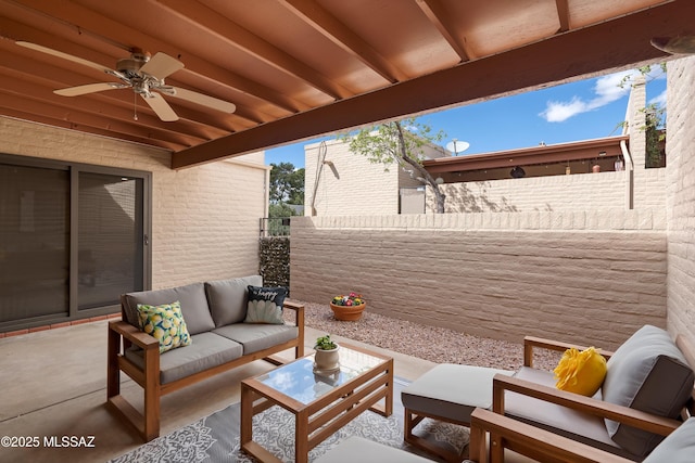 view of patio / terrace with a ceiling fan, fence, and an outdoor hangout area