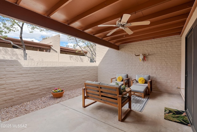 view of patio with a ceiling fan and fence