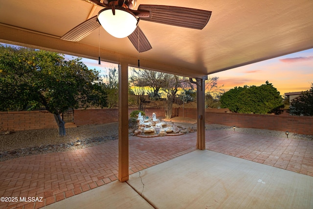 view of patio / terrace with a fenced backyard and a ceiling fan