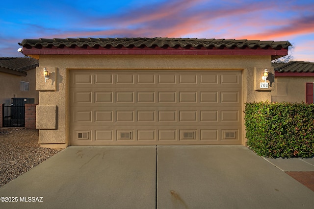 garage featuring driveway