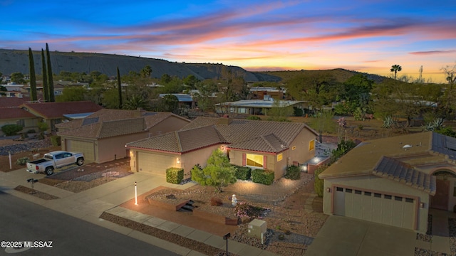 aerial view at dusk with a mountain view