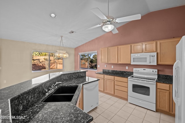 kitchen with light brown cabinetry, light tile patterned flooring, vaulted ceiling, a sink, and white appliances