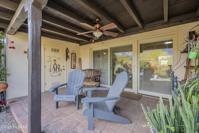 view of patio featuring visible vents and a ceiling fan