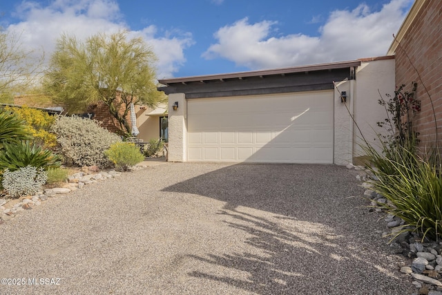 garage featuring driveway