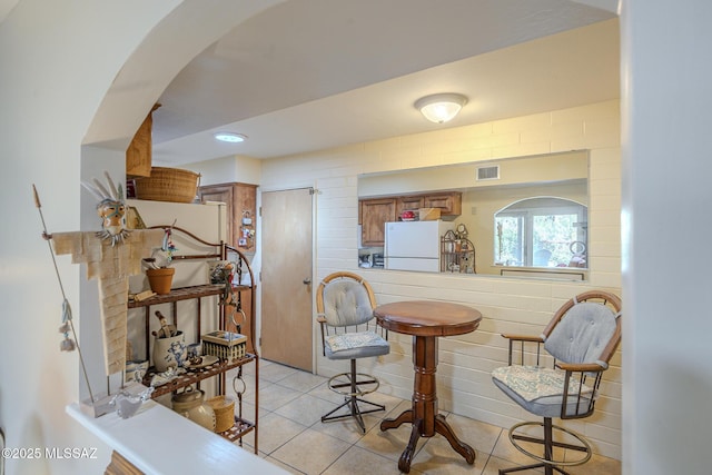 dining space with visible vents and light tile patterned floors