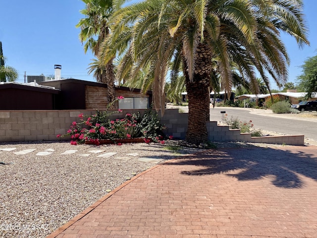 view of property exterior with fence