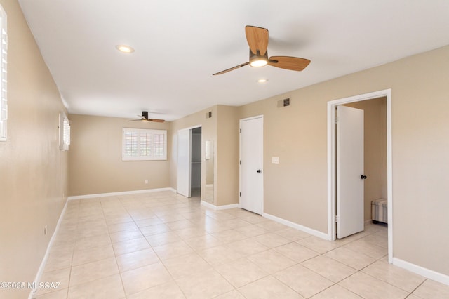 unfurnished room featuring light tile patterned floors, baseboards, a ceiling fan, and recessed lighting