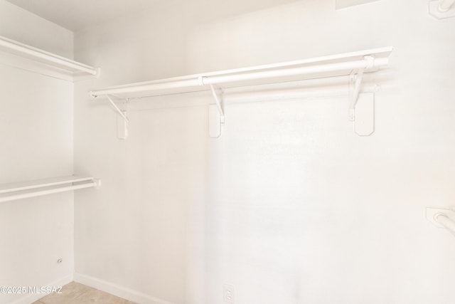 spacious closet with tile patterned flooring