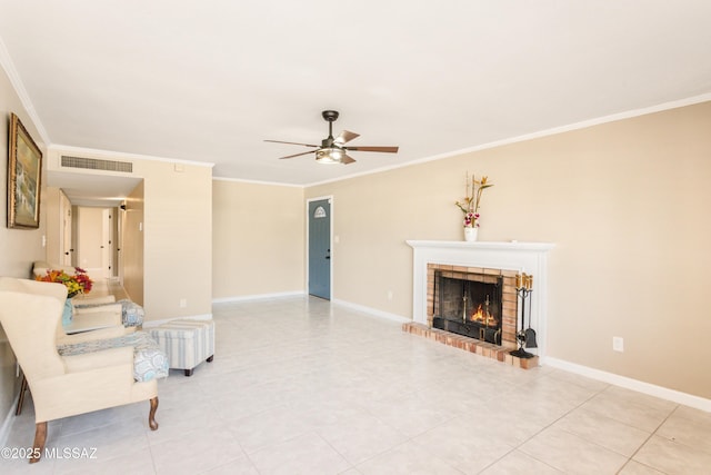 tiled living area featuring baseboards, visible vents, ceiling fan, ornamental molding, and a fireplace