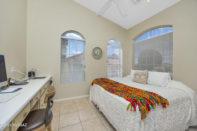 bedroom featuring a ceiling fan, baseboards, visible vents, light tile patterned flooring, and vaulted ceiling