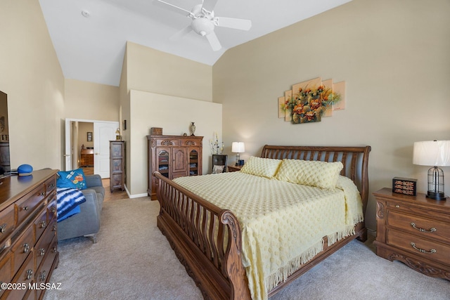 bedroom with baseboards, carpet floors, high vaulted ceiling, and a ceiling fan