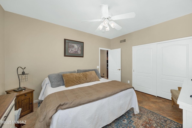 bedroom with a closet, visible vents, and a ceiling fan