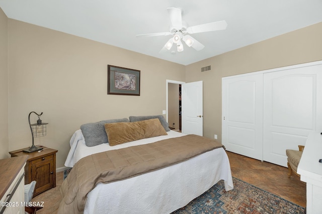 bedroom featuring visible vents, a closet, and a ceiling fan