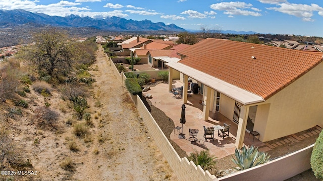 drone / aerial view with a mountain view and a residential view