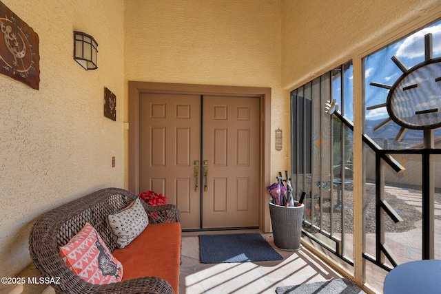 doorway to property with stucco siding