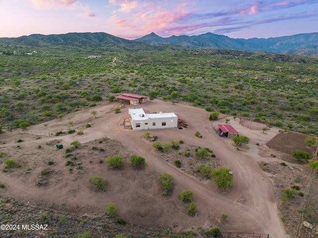 birds eye view of property with a mountain view