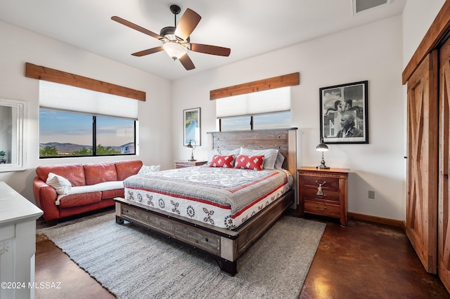 bedroom featuring a ceiling fan, visible vents, concrete floors, and baseboards